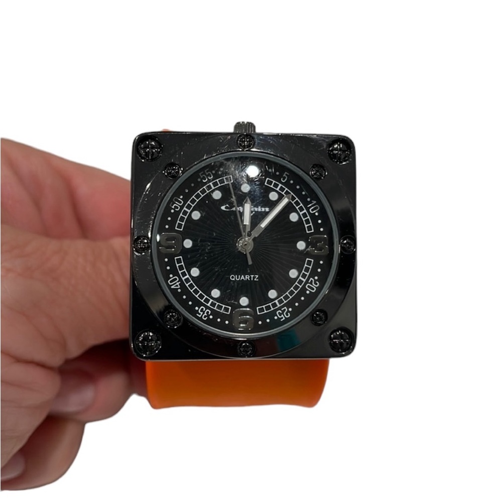 Square quartz movement watch with orange wrap bracelet. NWOT
